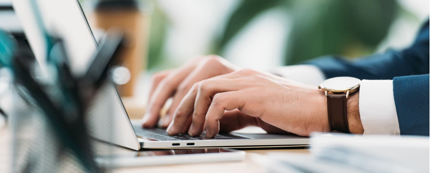 Online Marketing Services | Online Advertising | Man Typing on Laptop