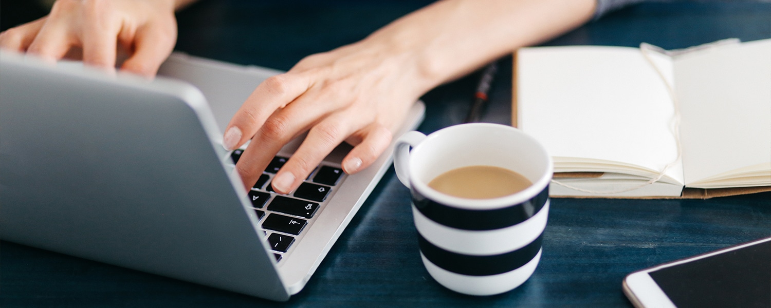 Content Marketing Services | Why Use Content Marketing? | Person at Laptop Writing