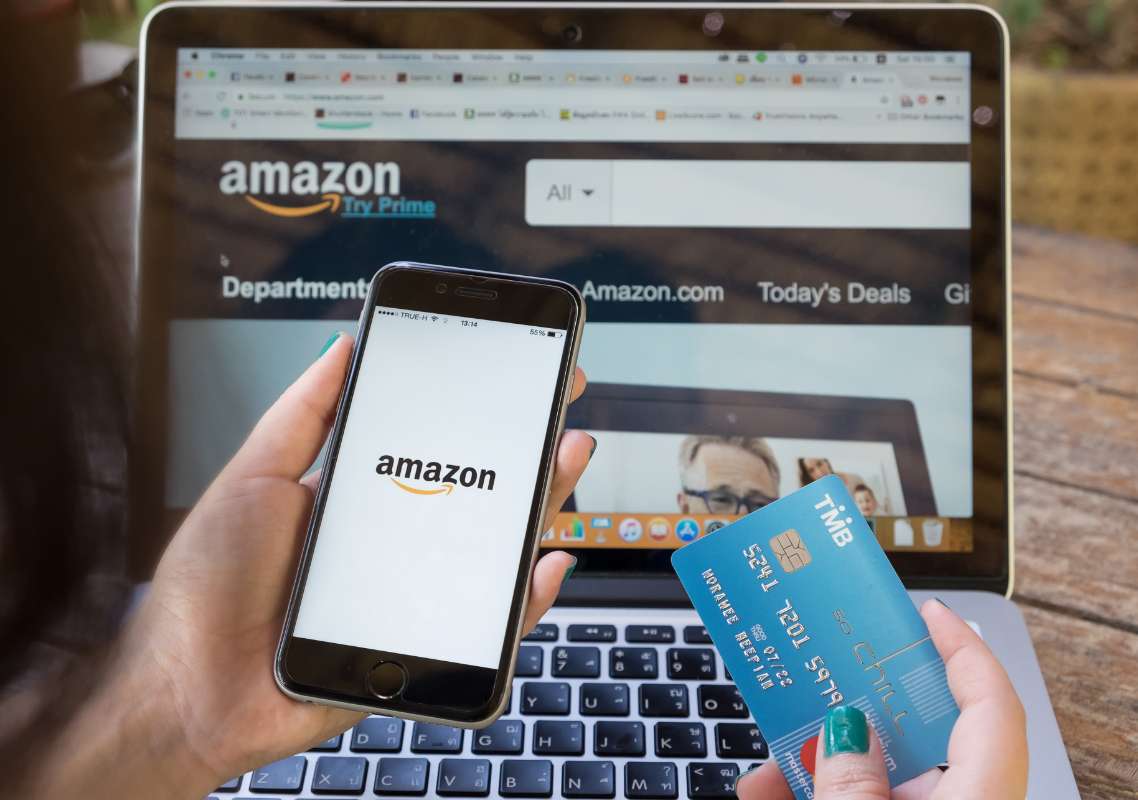 Cell phone displaying Amazon Marketing platform - Direct Online Marketing internet marketing company - Provider of Amazon Marketing Services