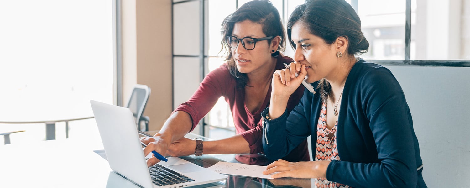 How to Rebrand | Services for Rebranding | Two Coworkers at Laptop