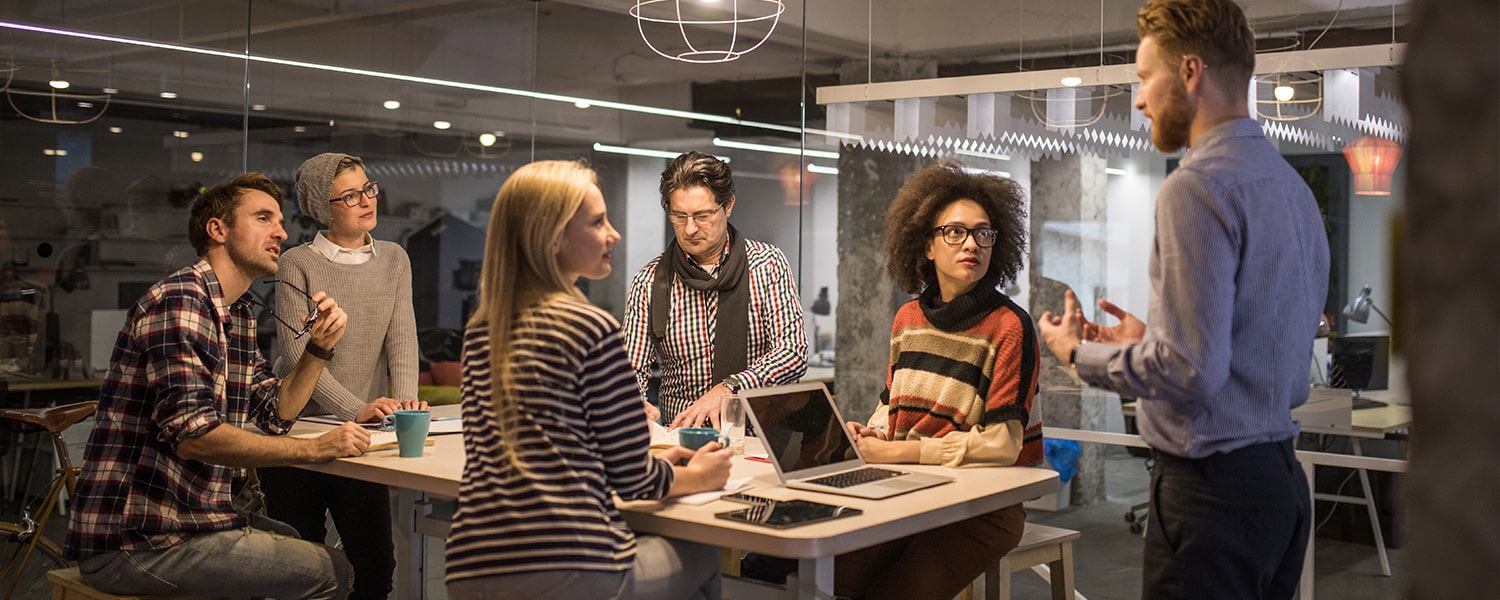 Strategic Digital Marketing | Digital Marketing Strategy | Man Presents Idea to Coworkers
