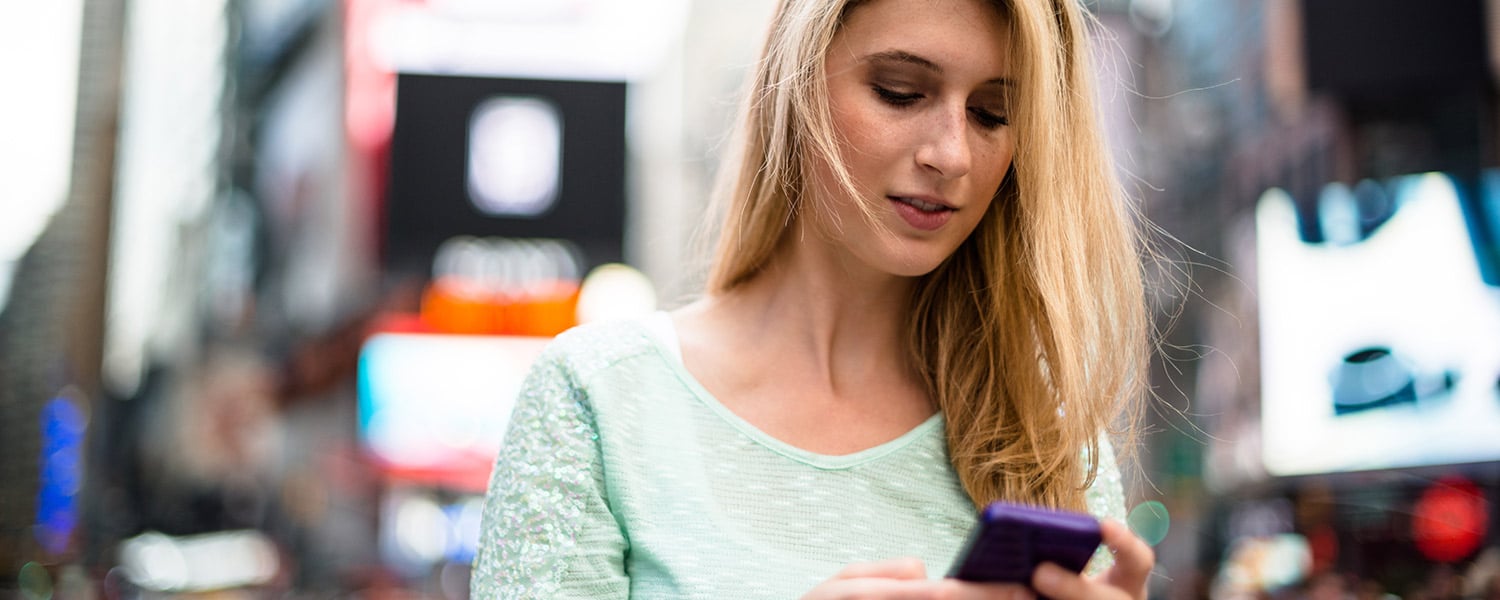 Traditional Marketing vs. Unified Marketing | Omnichannel Marketing Explained | Woman Reading Phone in Public