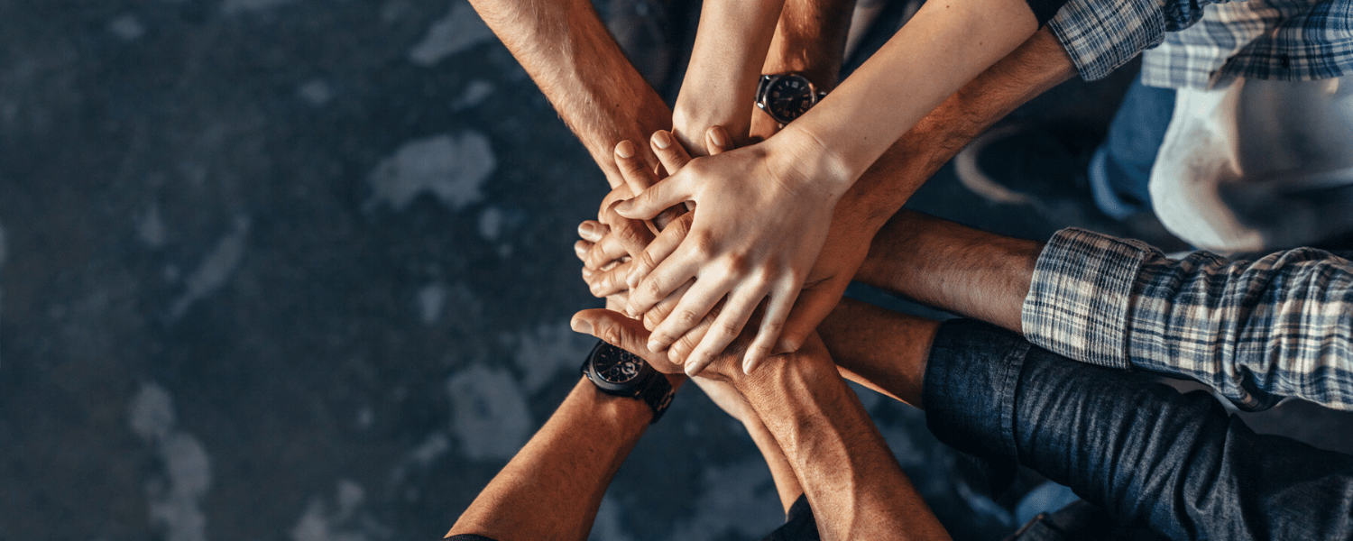 When to Outsource Digital Marketing | How to Outsource Digital Marketing | Team Puts Hands in Center